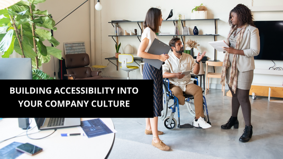 a person in a wheelchair with 2 more employees in a office setting